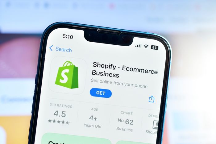 Shopify app on phone used to create ecommerce website for online business