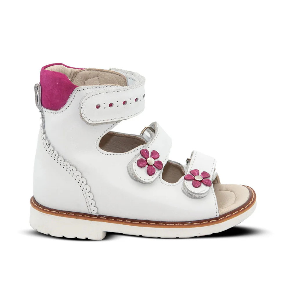 a white shoe with pink flowers on the side