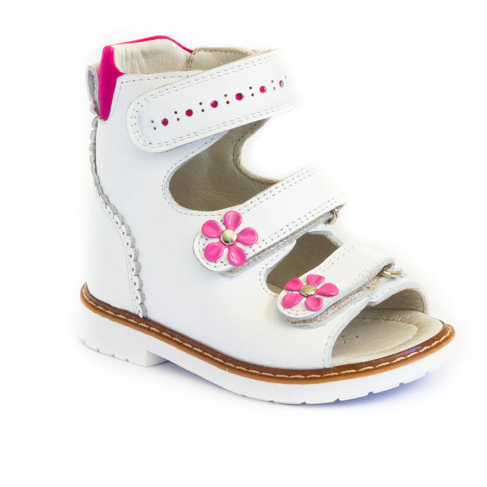 a white shoe with pink flowers on the side