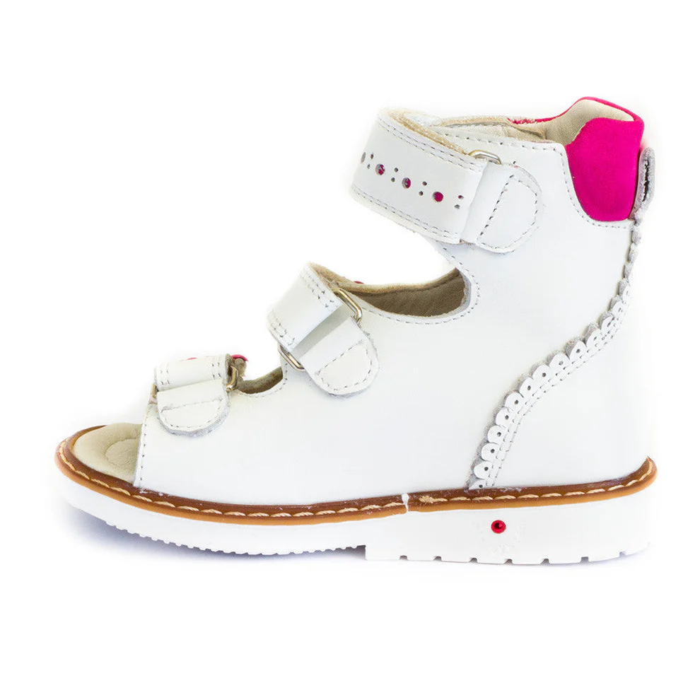 a pair of white shoes with pink accents