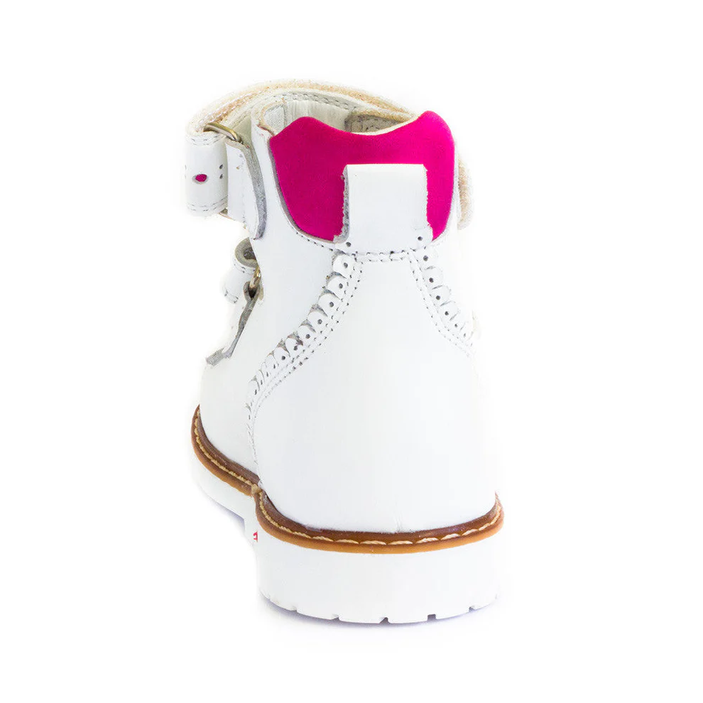 a pair of white boots with pink soles