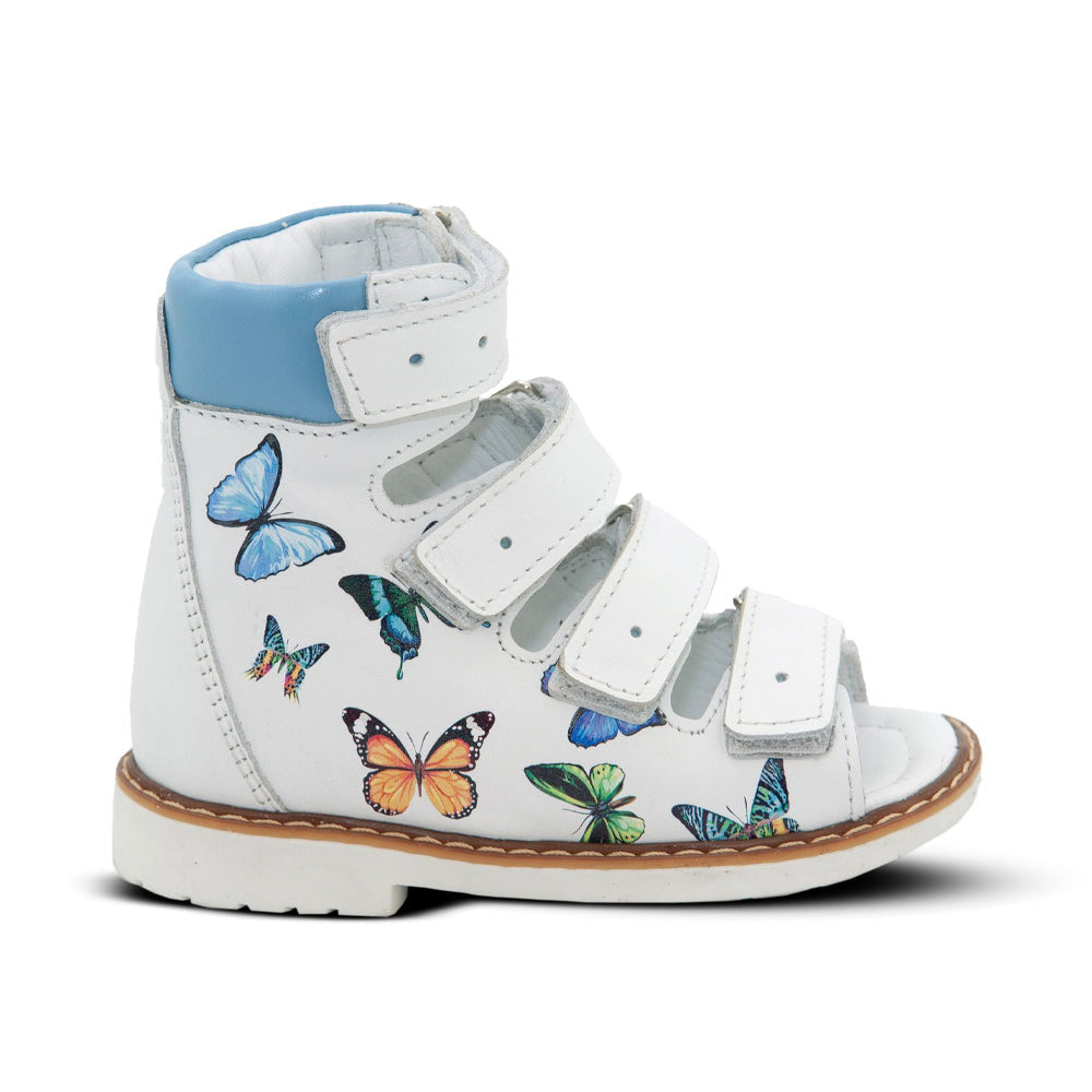 a white shoe with butterflies on it