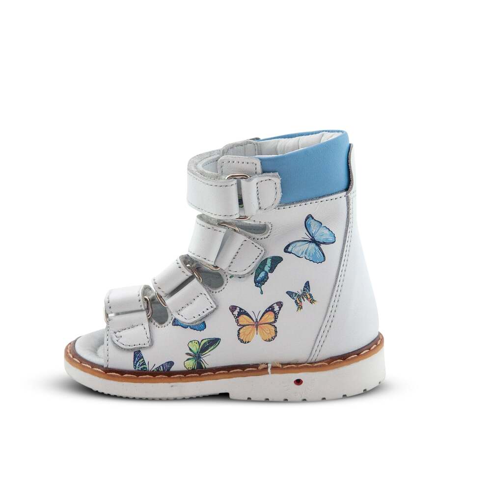 a white shoe with butterflies on it