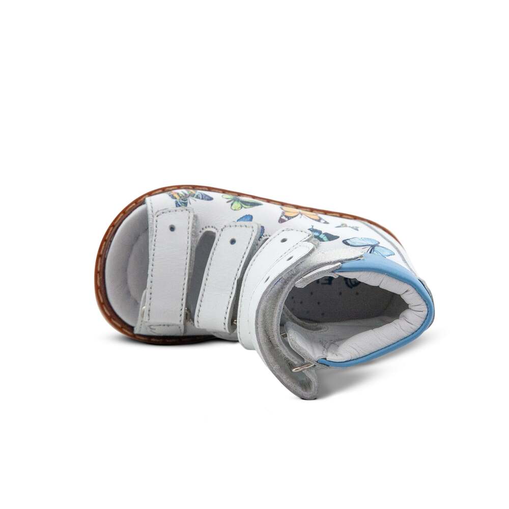 a pair of white shoes with blue trims
