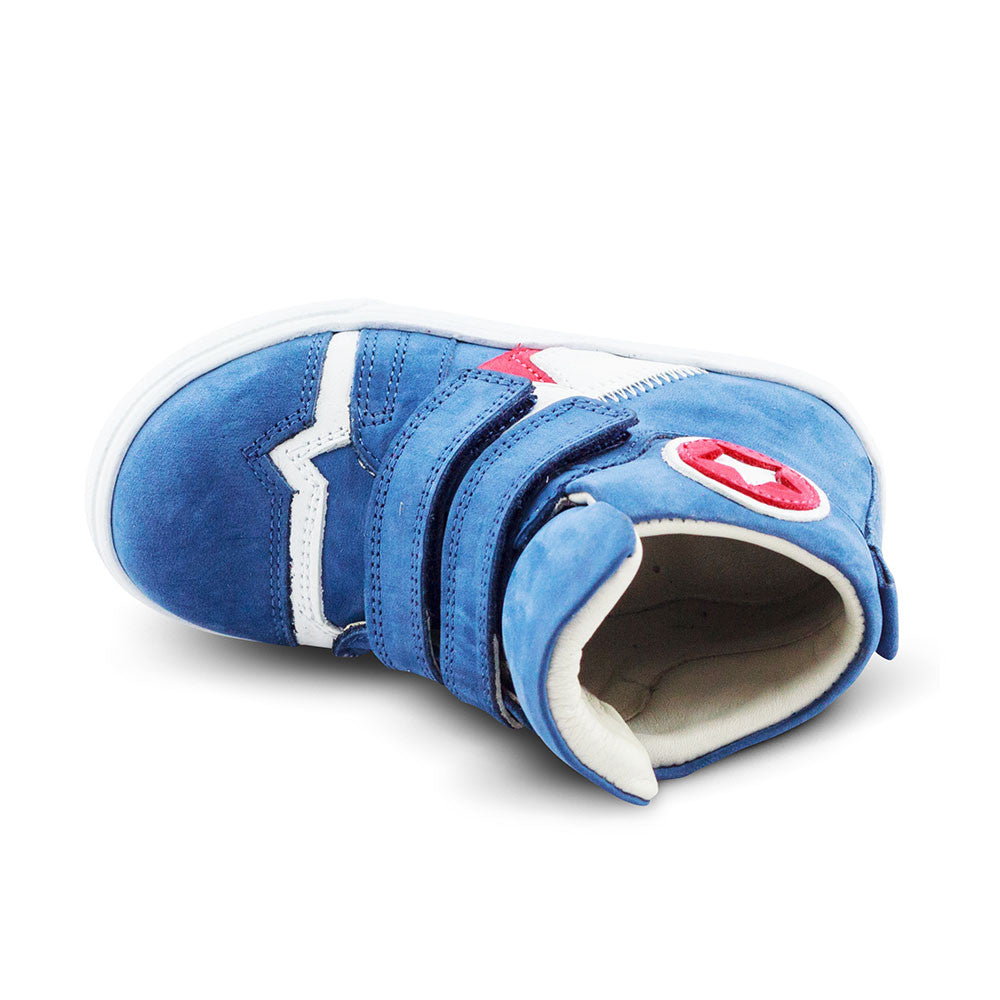 a blue sneaker with a red and white star on the side