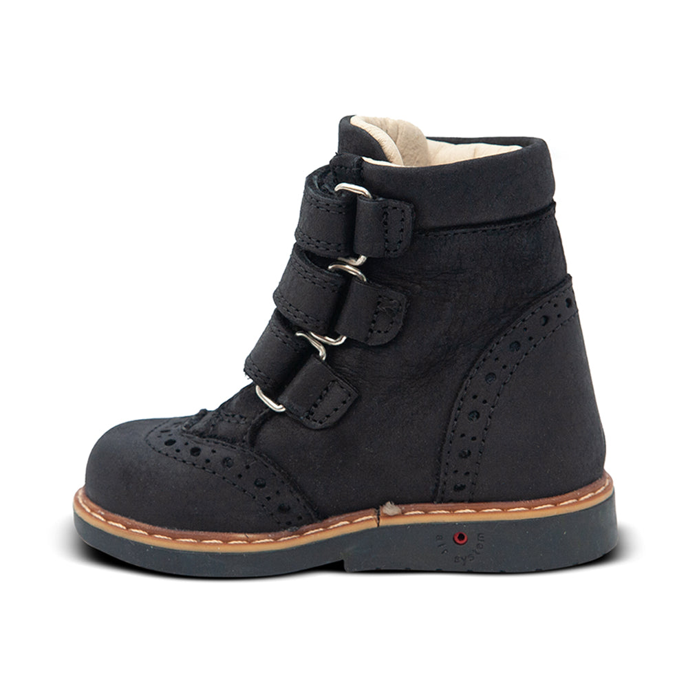 a child's shoe with a buckle on the side