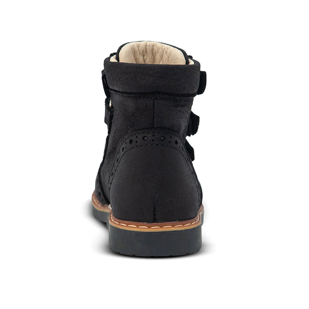 a close up of a black shoe on a white background