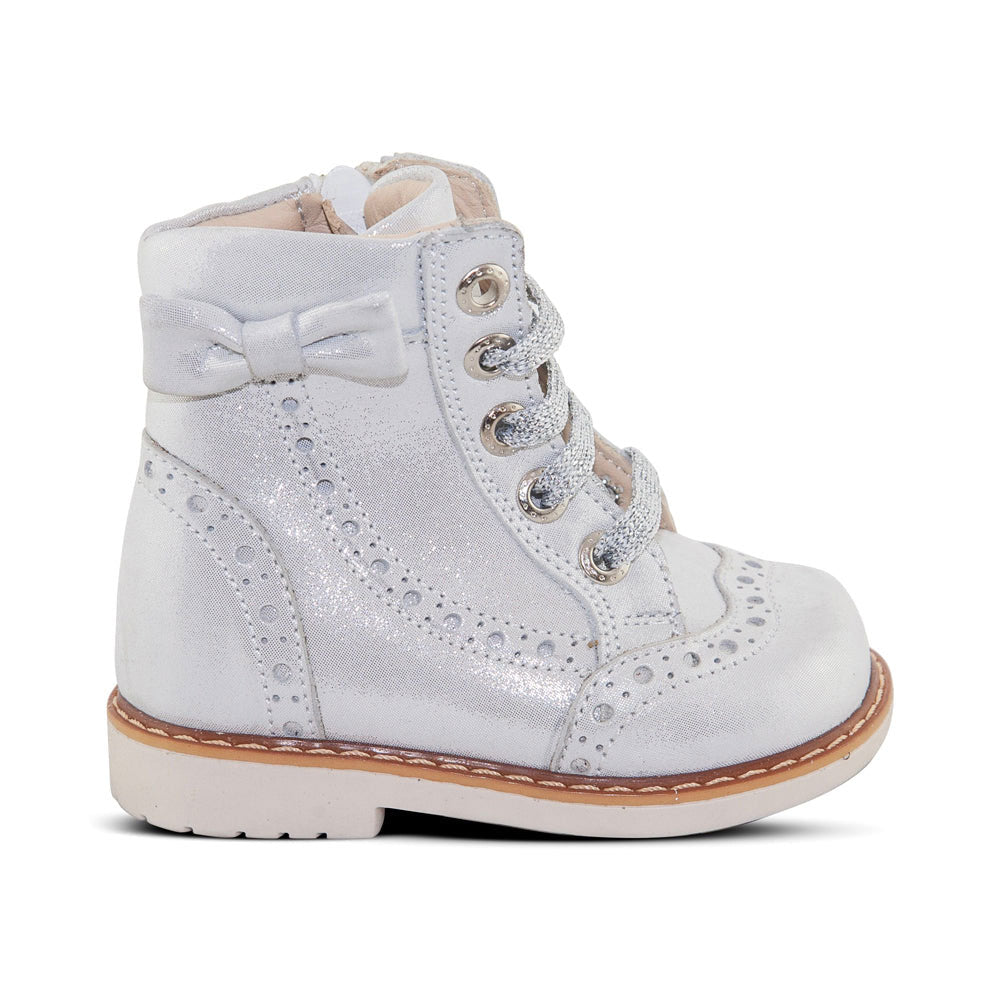 a white shoe with a bow on the side