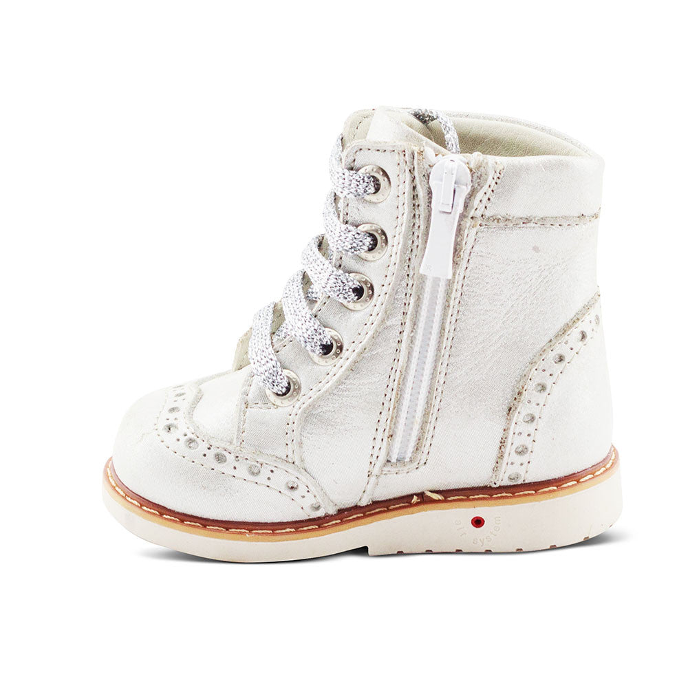 a white boot with a zipper on the side