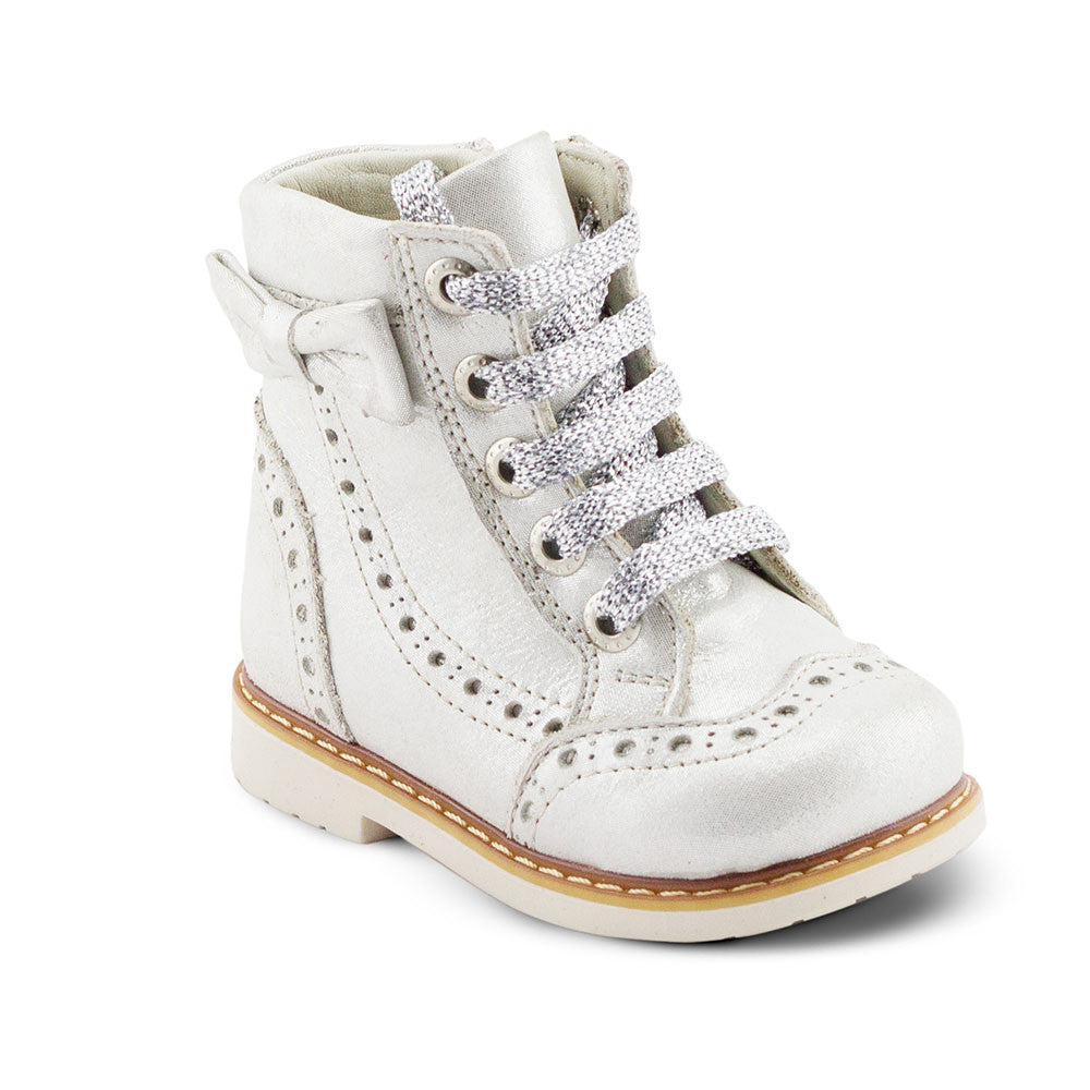 a child's white shoe with a lace on the side