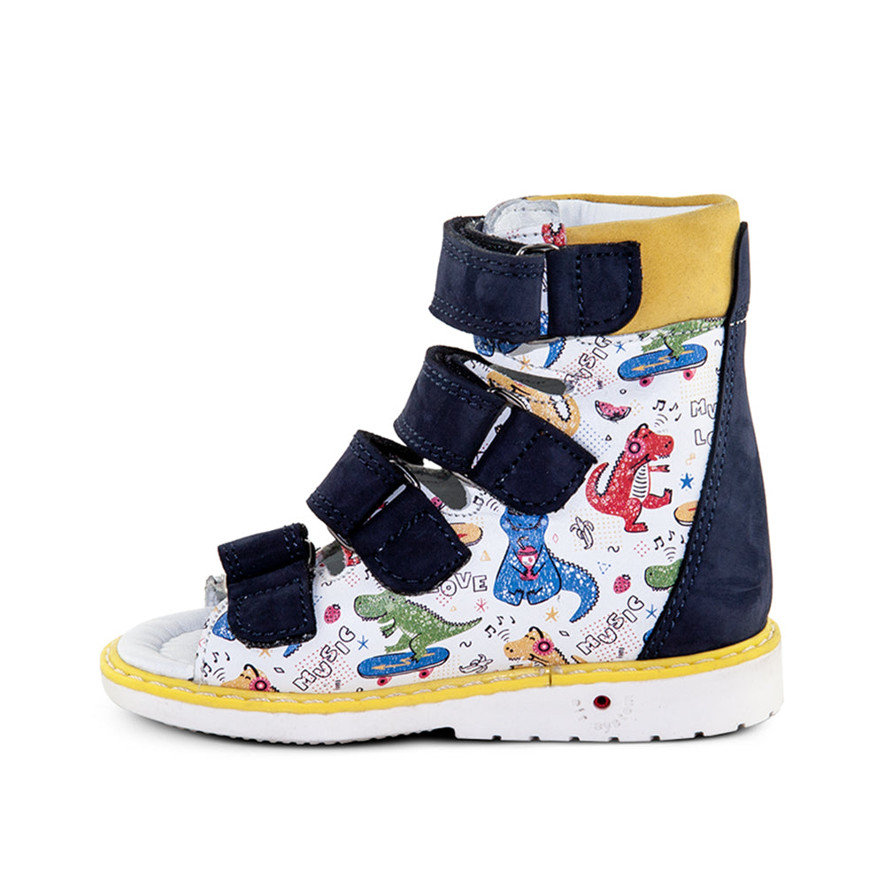 a pair of children's shoes with dinosaurs on them