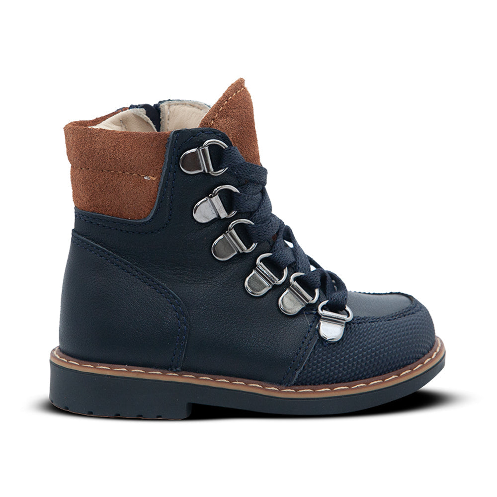 a pair of blue boots with a brown sole
