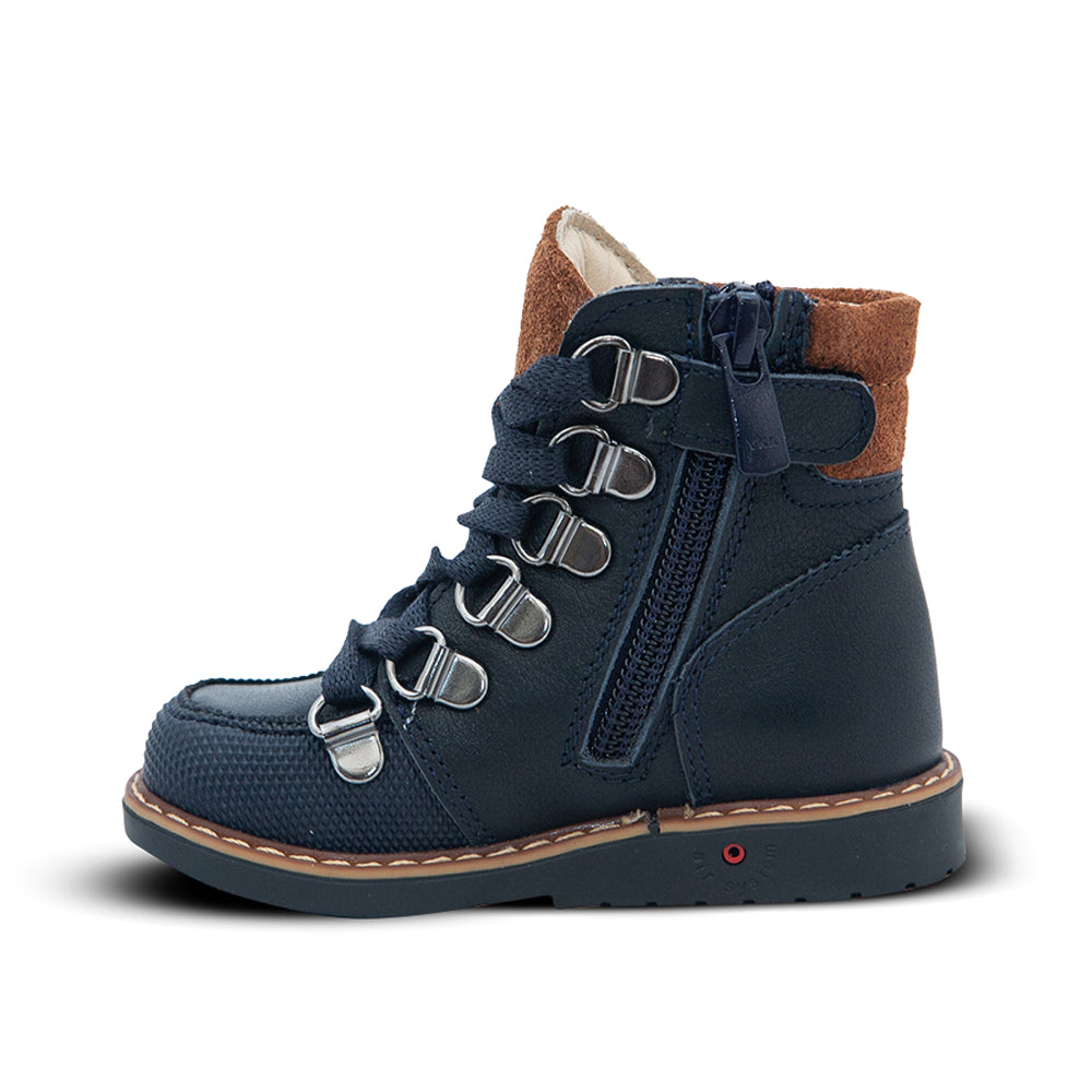 a child's boot with a zipper on the side