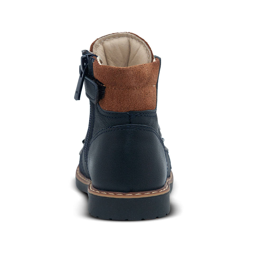 a close up of a child's boot on a white background