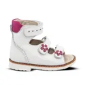 a white shoe with pink flowers on the side