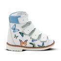 a white shoe with butterflies on it
