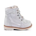 a white shoe with a bow on the side