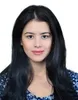 a woman with long black hair wearing a blue shirt