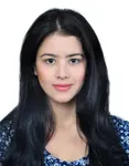 a woman with long black hair wearing a blue shirt