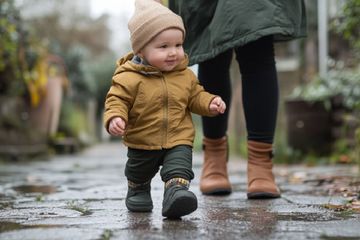 A 12-month old running outside.