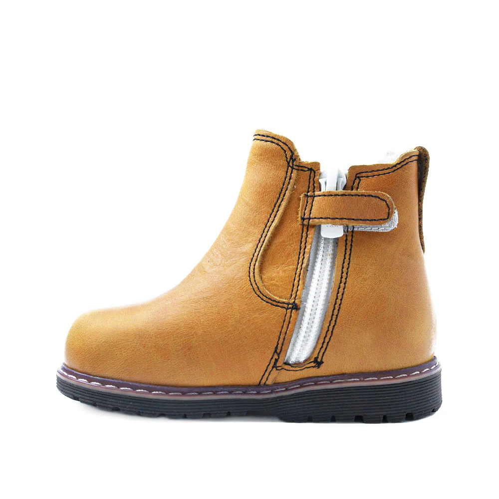 a child's yellow boot with a zipper on the side