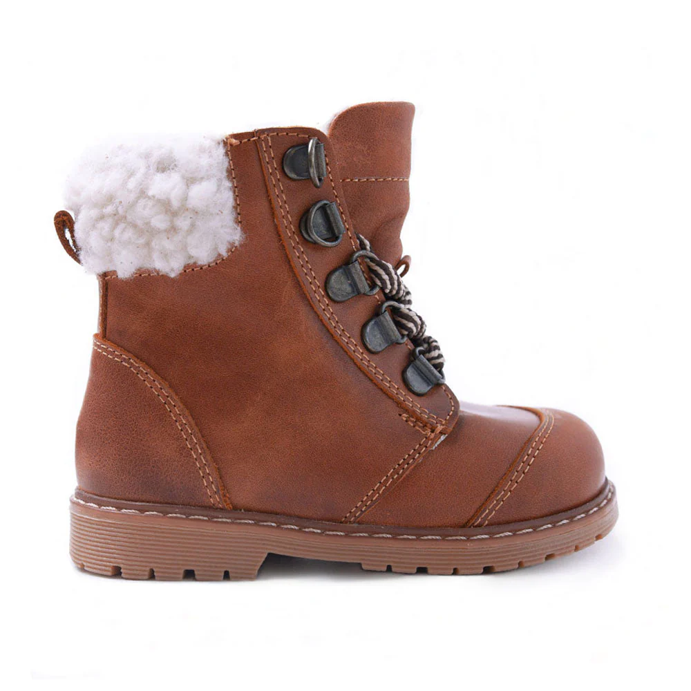 a pair of brown boots with white fur