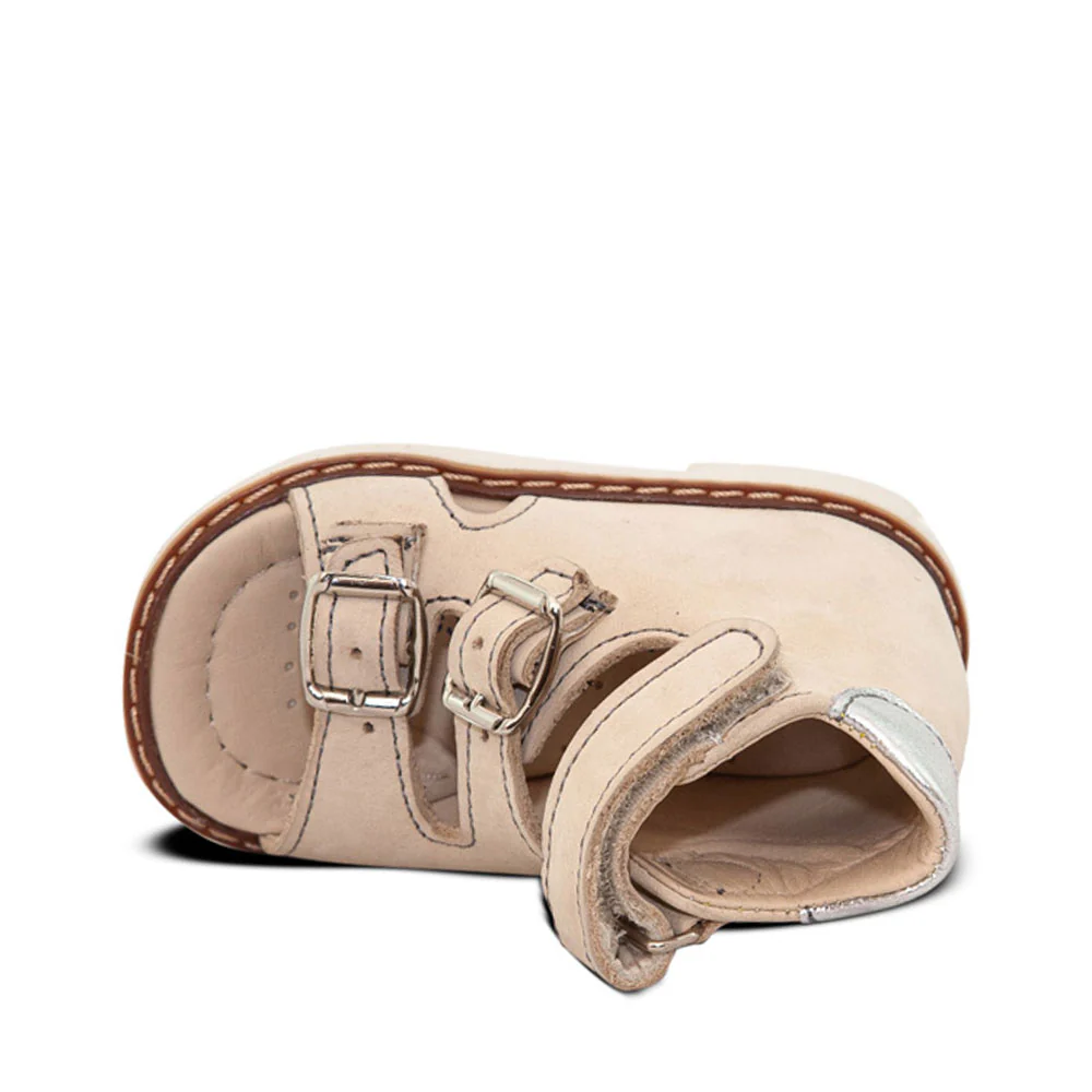 a baby's sandal with straps and buckles