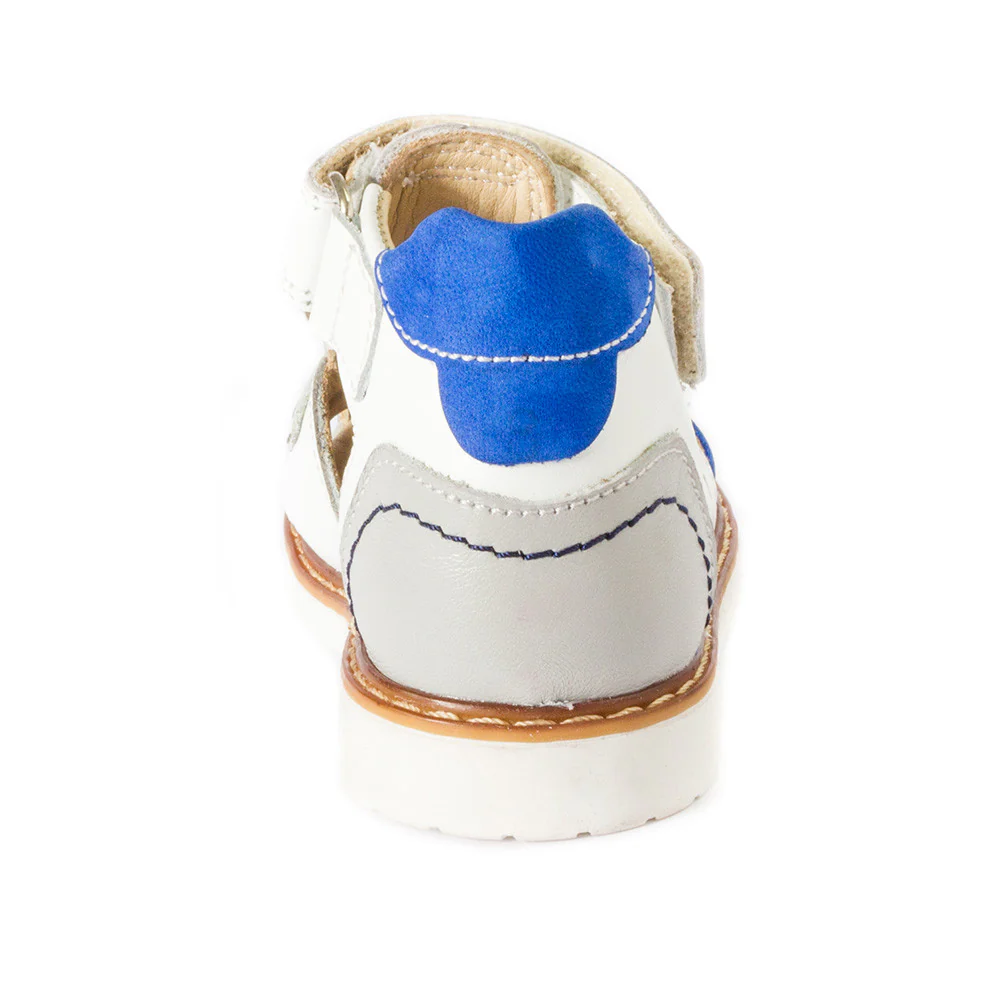 a white and blue shoe with a blue shoelace