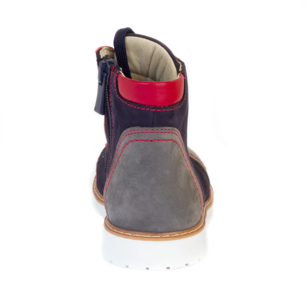 a close up of a child's boot on a white background