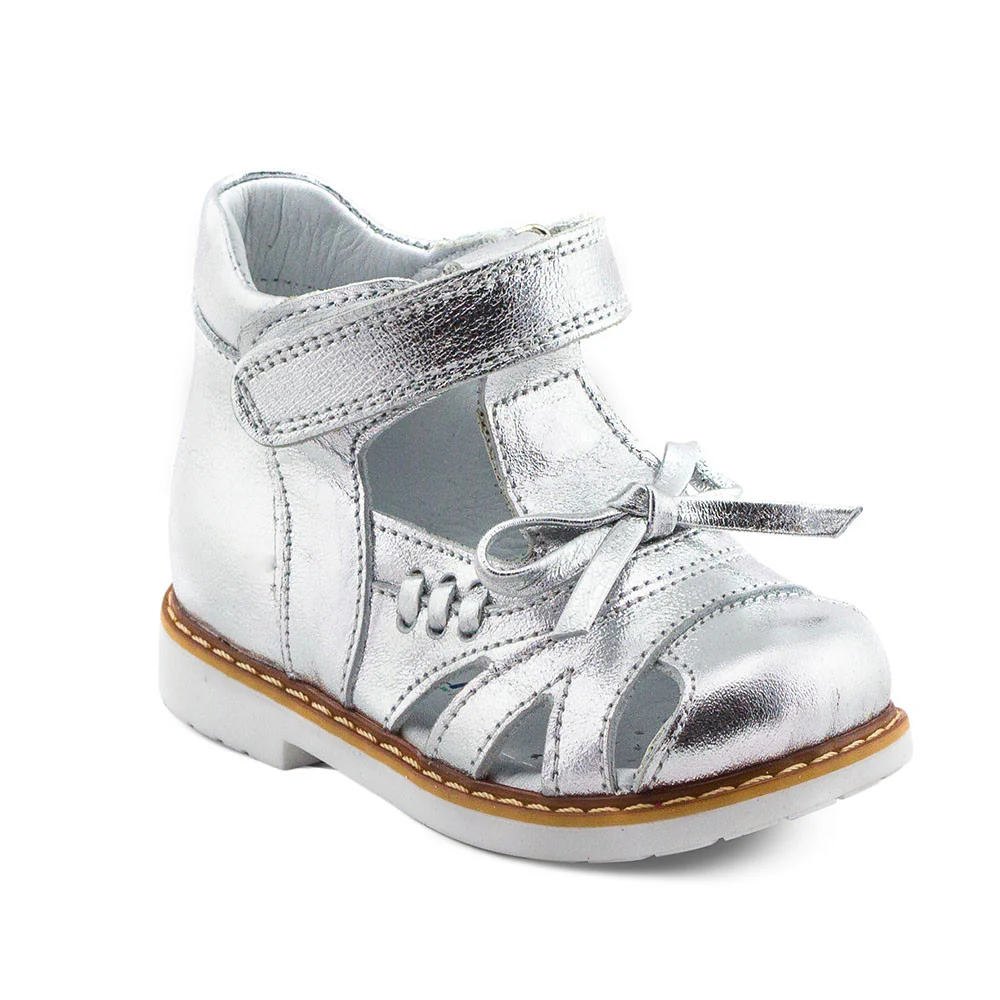 a silver shoe with a bow on the side