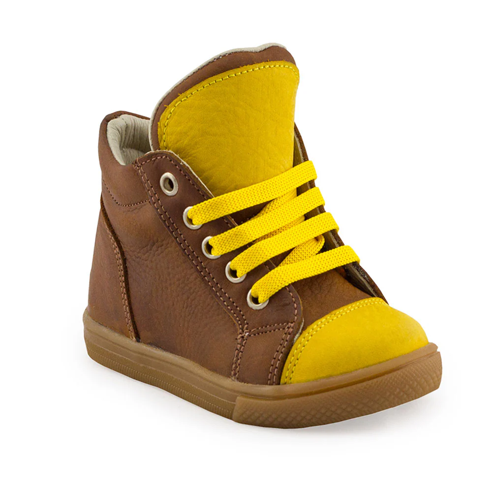 a brown and yellow shoe with yellow laces