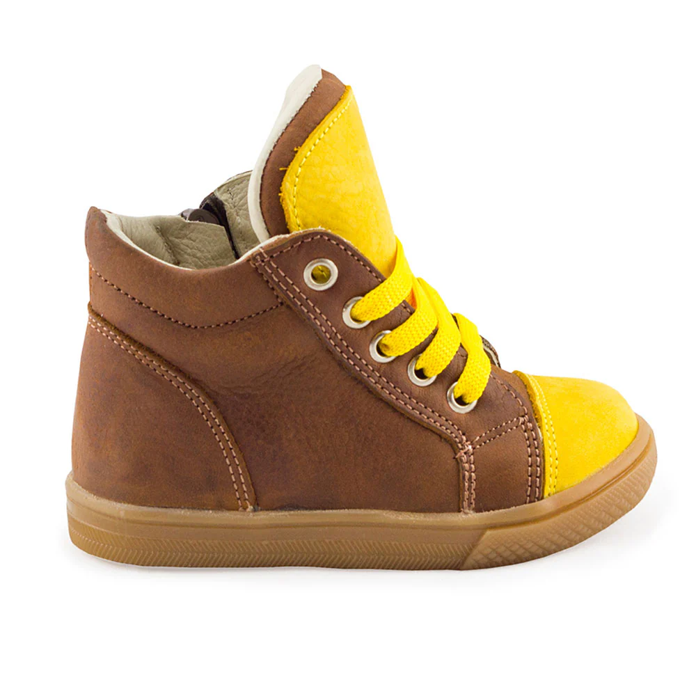 a brown and yellow shoe with yellow laces