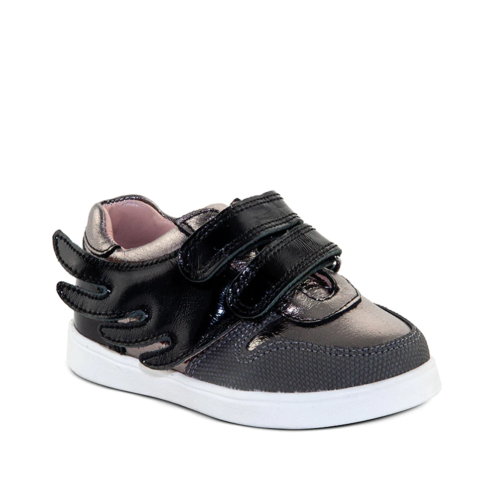 a little girl's black and silver sneakers