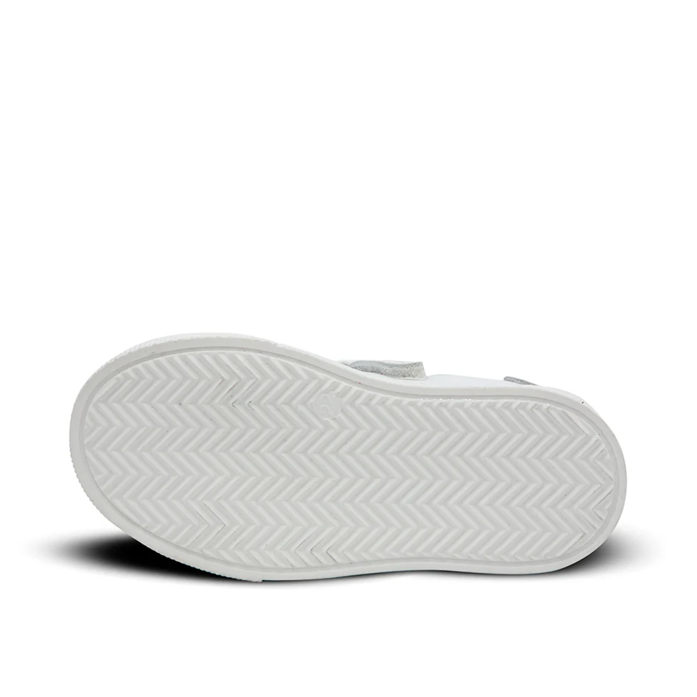 a pair of white shoes on a white background