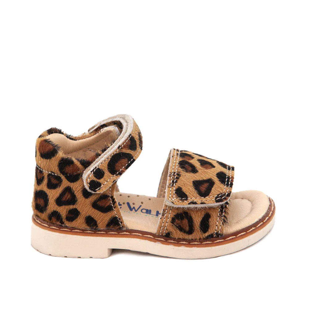 a toddler's shoe with a leopard print