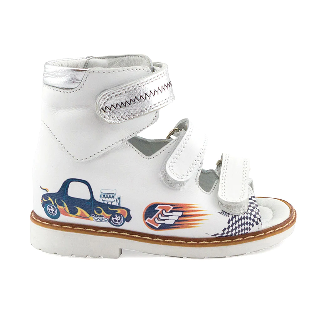 a pair of white shoes with cars on them