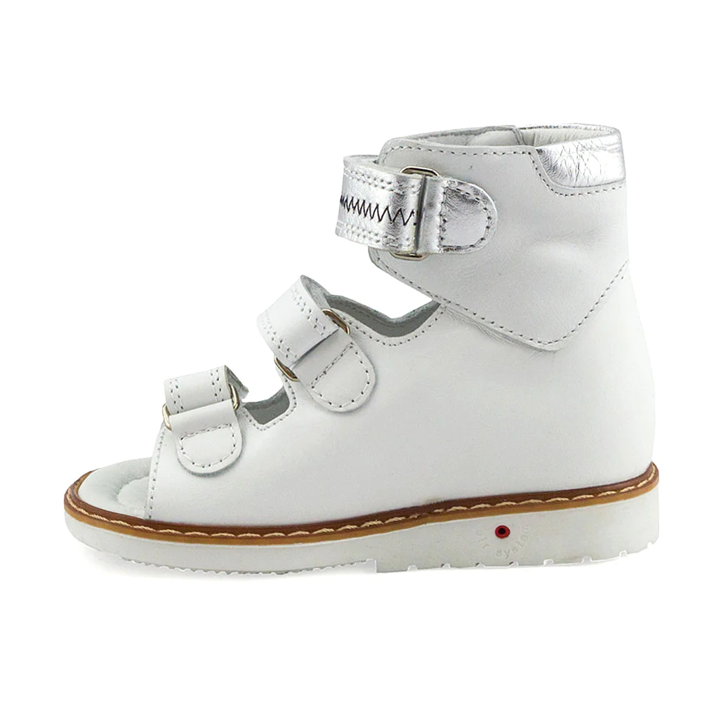 a child's white shoe with two straps