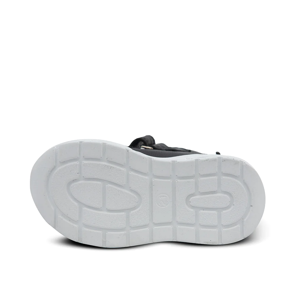 a pair of black and white shoes on a white background
