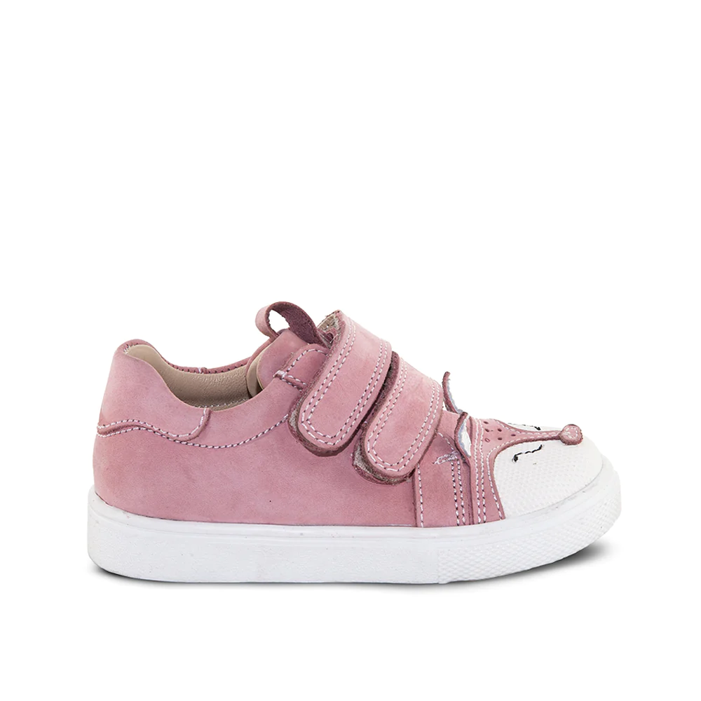 A little girl's pink sneaker with two straps - outer side view