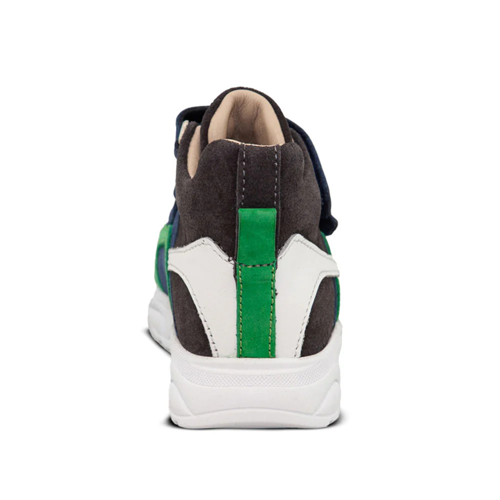 a black and green sneaker with a white sole
