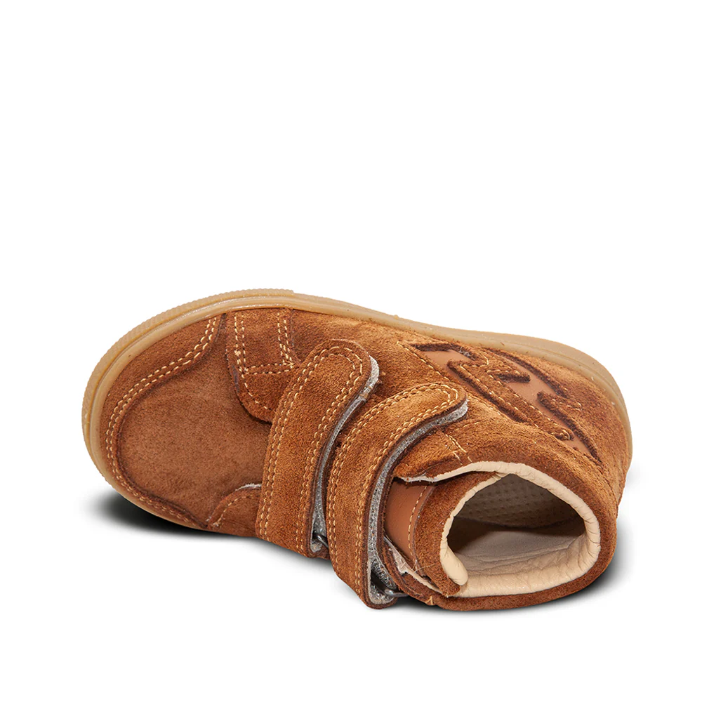 a pair of brown shoes on a white background