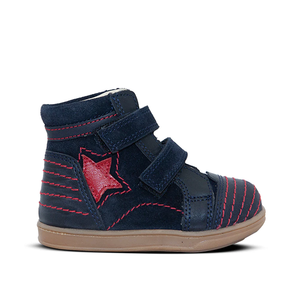 a child's shoe with a star on the side