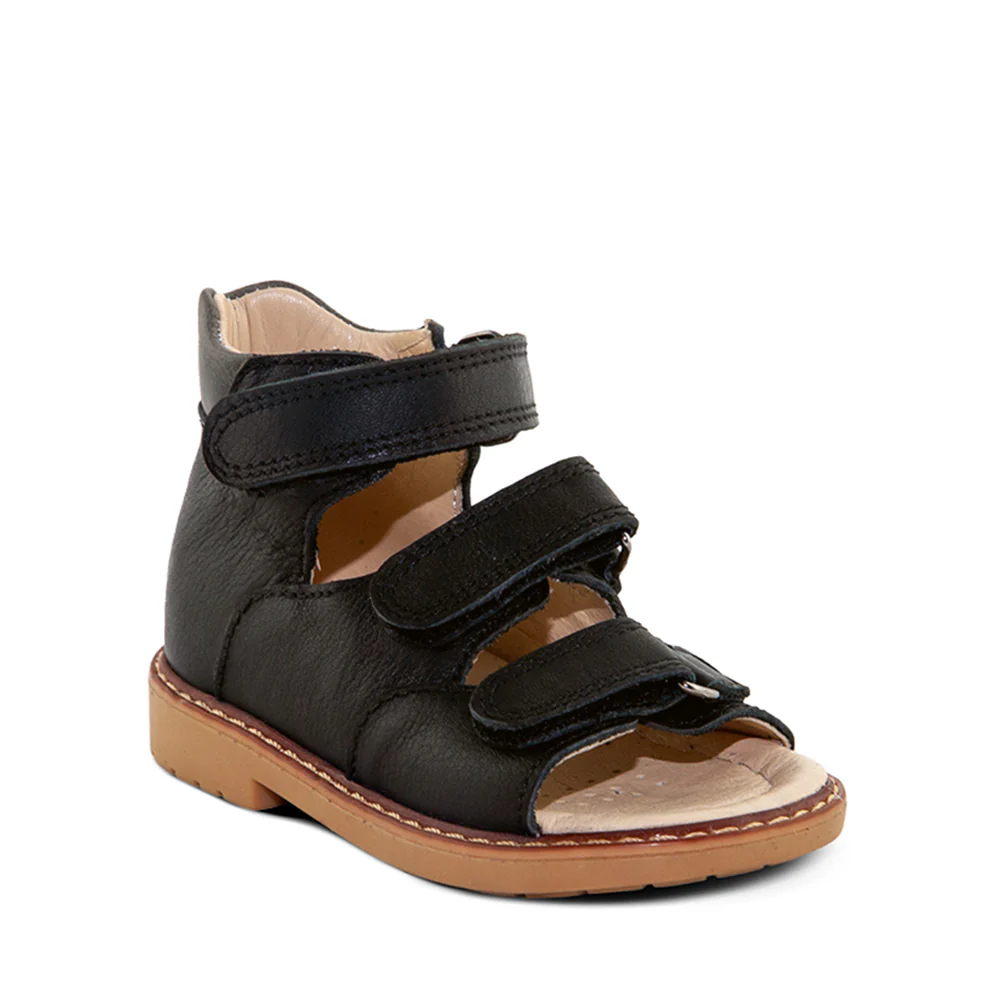 a little boy's black sandal with two straps