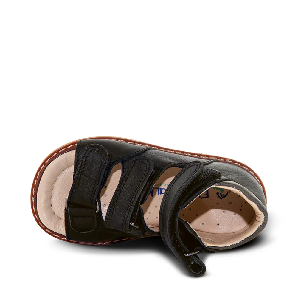 a pair of black shoes with straps on them