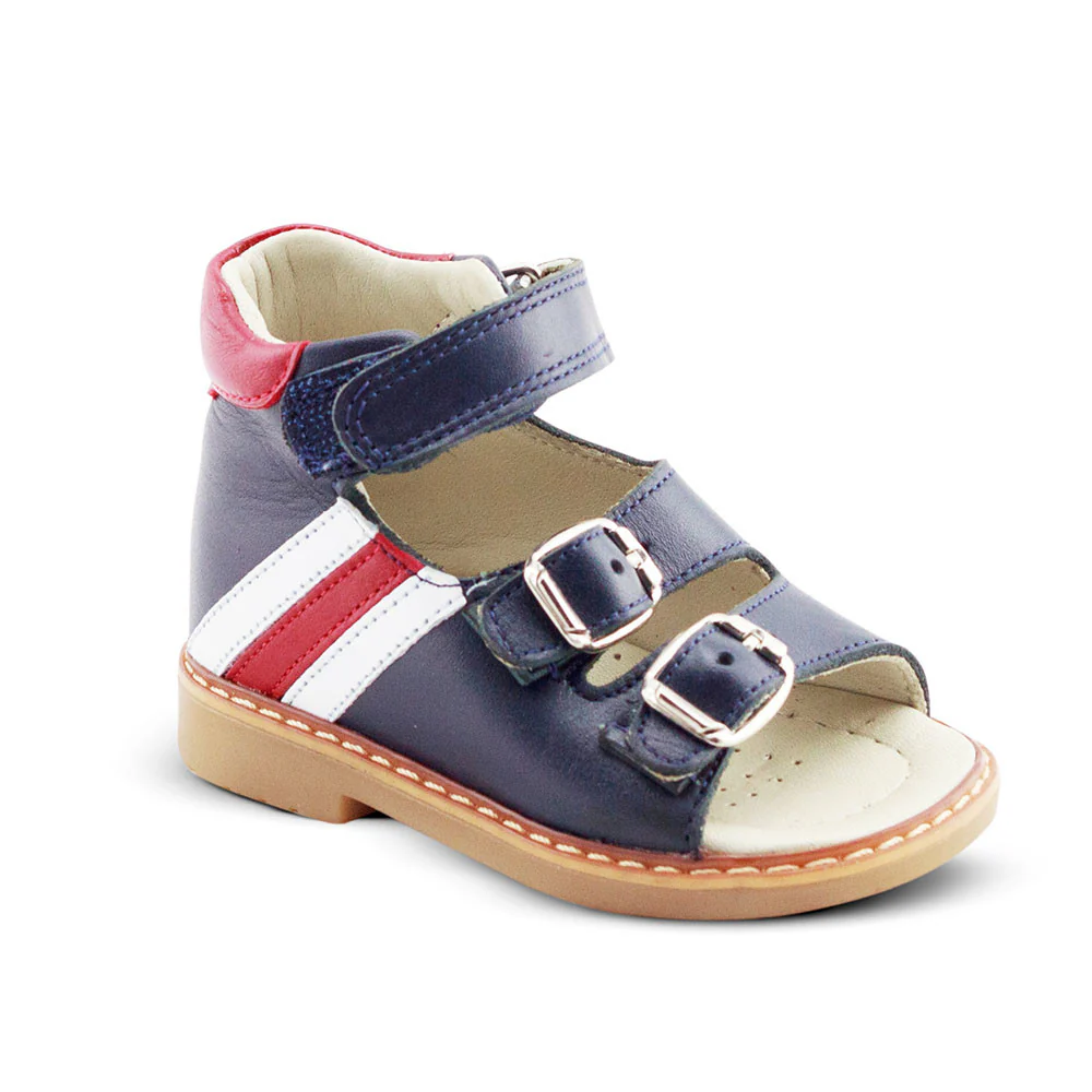 a child's shoe with two straps and two buckles