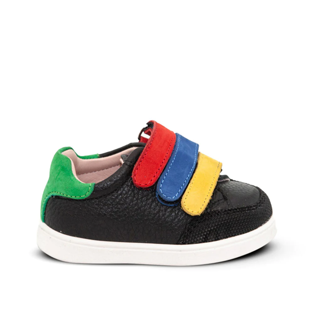 A child's black sneaker with multi-coloured straps