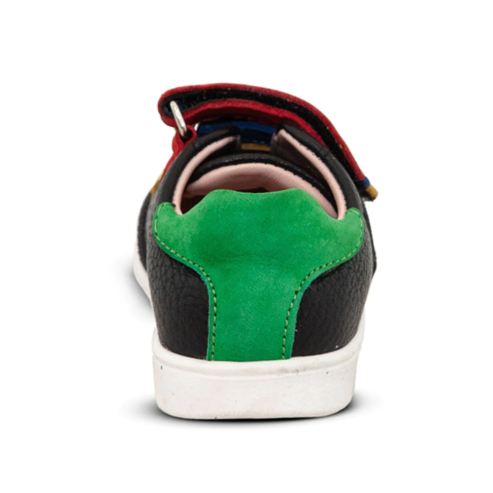 A black and green child's sneaker