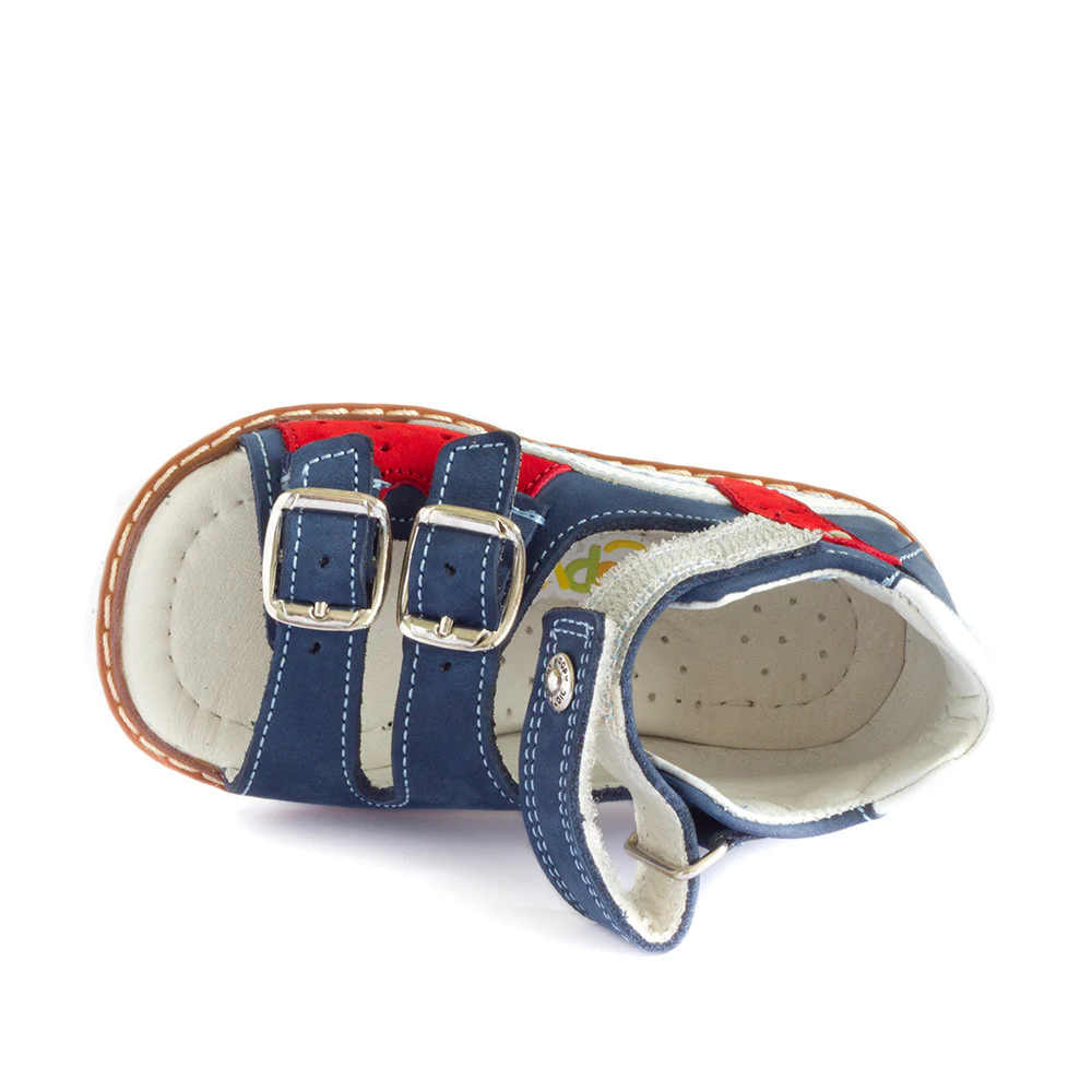 A child's sandal with a red, white, and blue color scheme