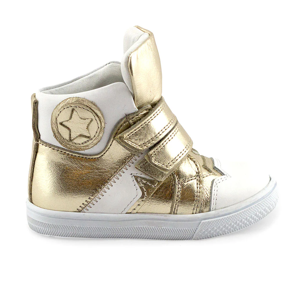a gold and white high top sneaker with a star on the side