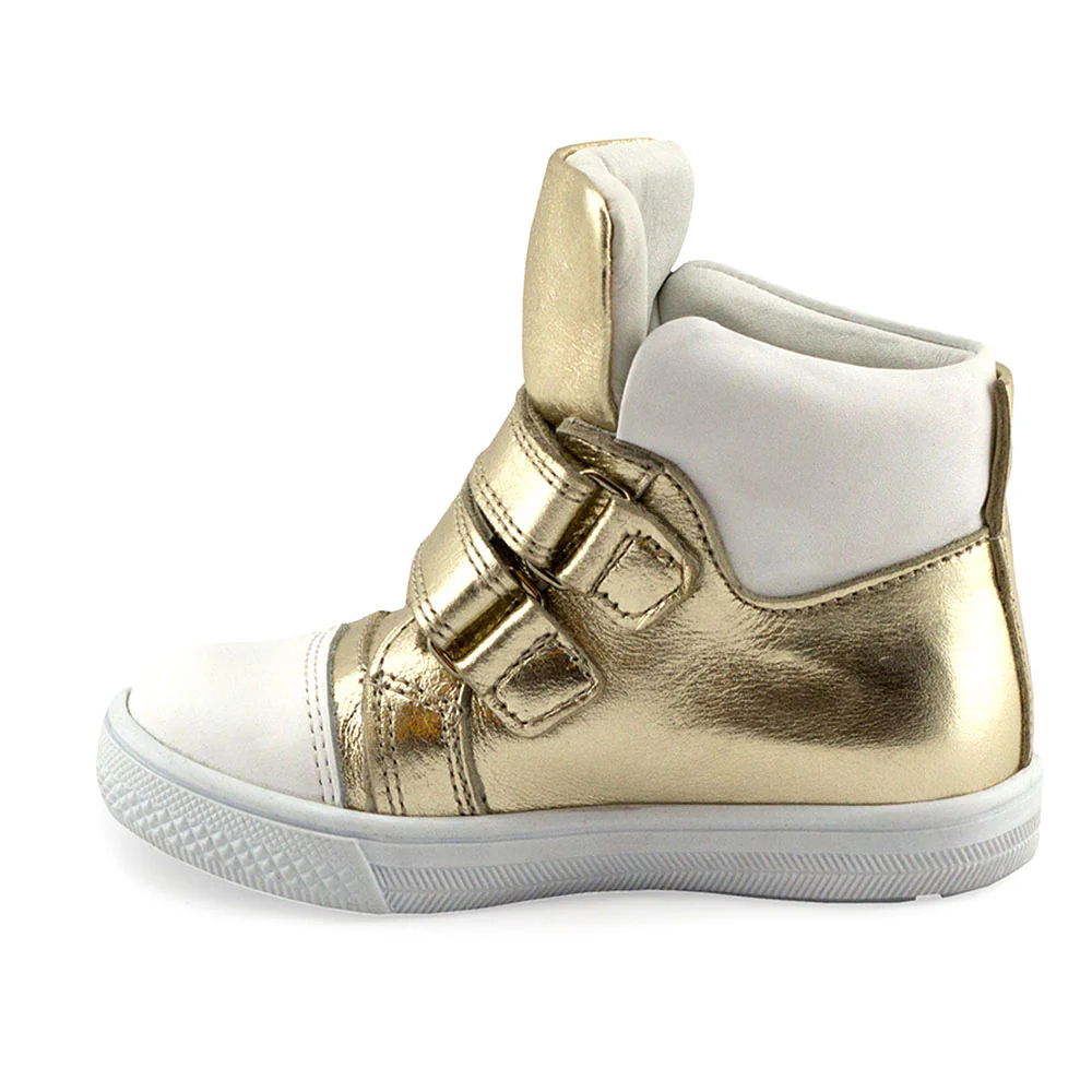 a child's gold and white high top sneaker